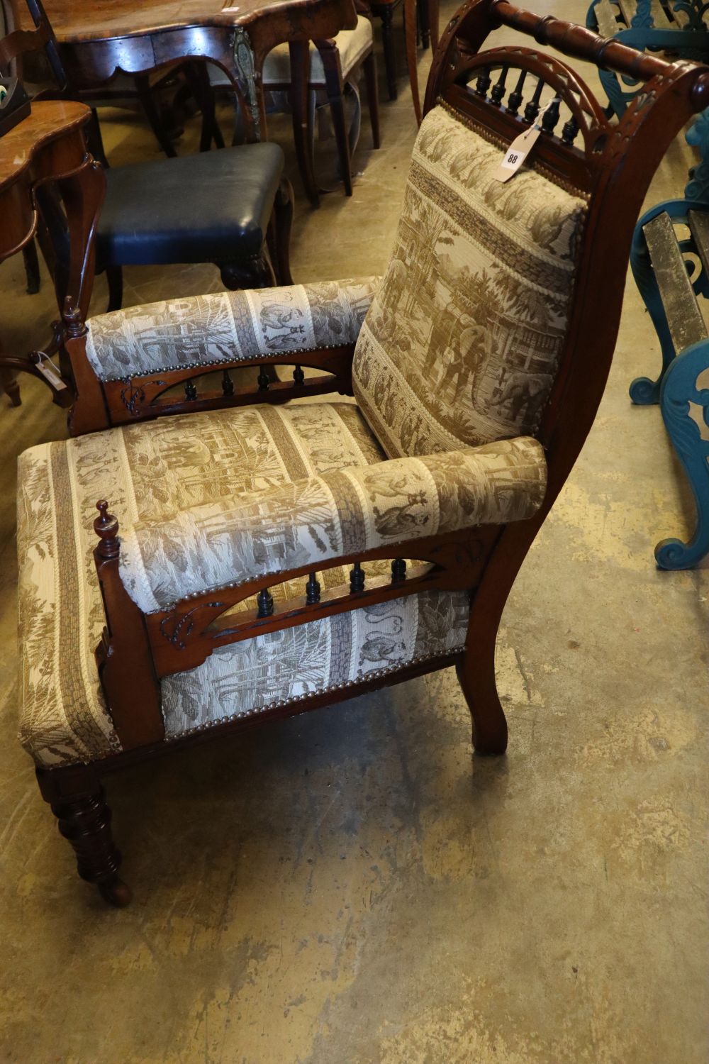 A Victorian aesthetic movement inlaid mahogany armchair, with later elephant pattern upholstery, width 68cm height 93cm
